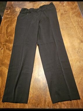 C3, The product is a pair of black dress pants for women by the brand Investment